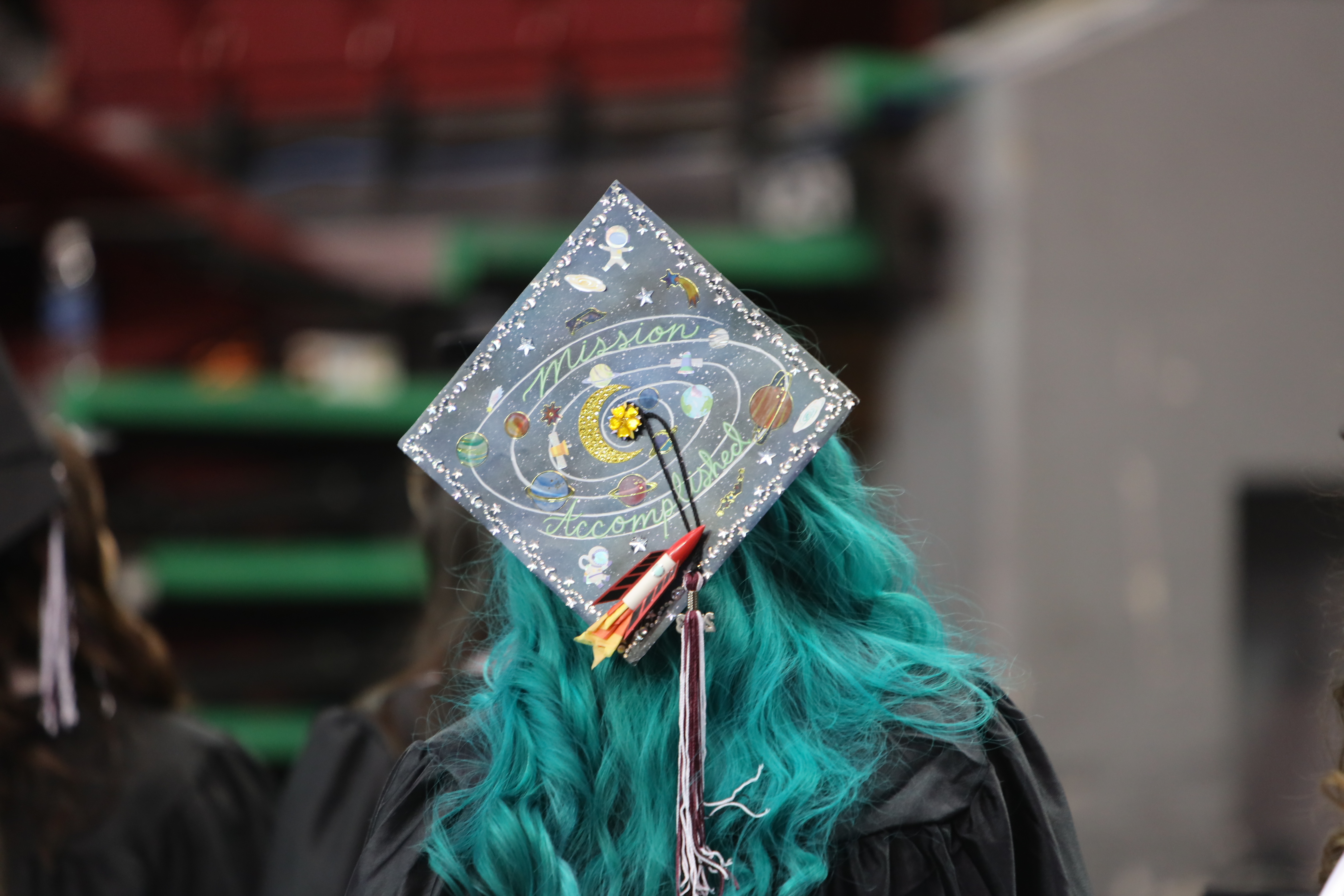 a decorated graduation cap on top of a students head
