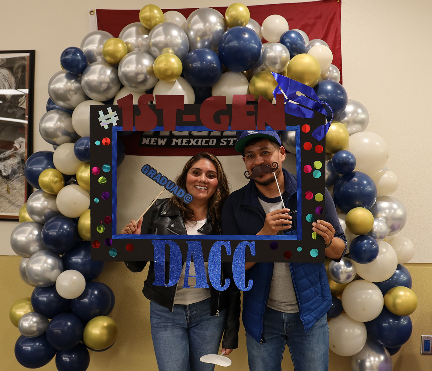 A pair surrounded by ballons in celebration of DACC.